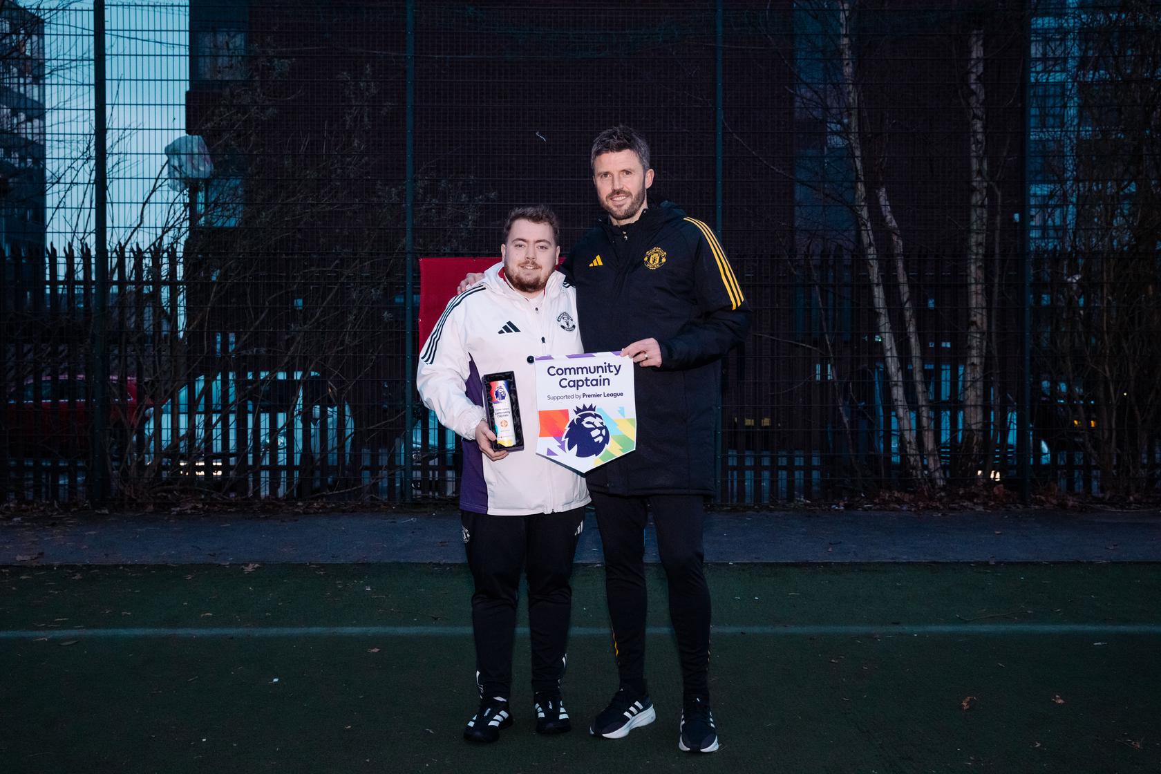 Carrick presents Community Captain award