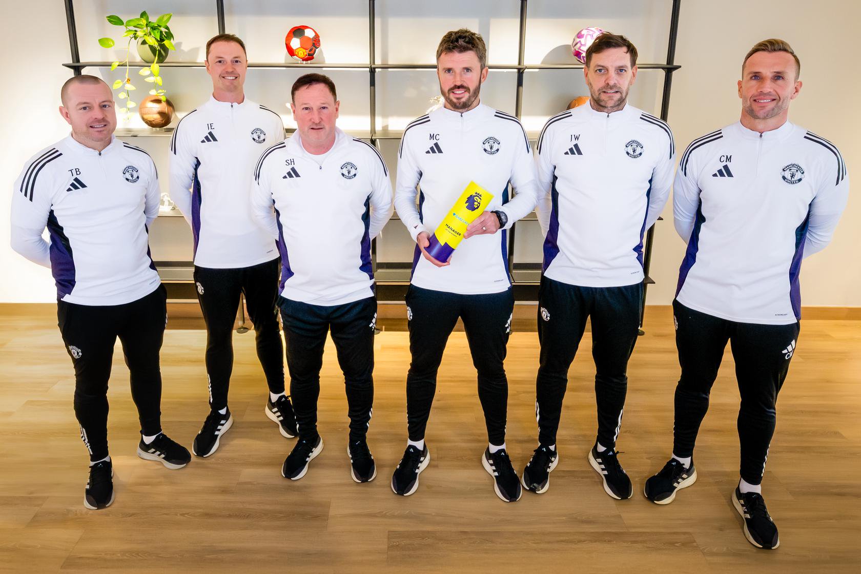 Michael Carrick with his coaching staff