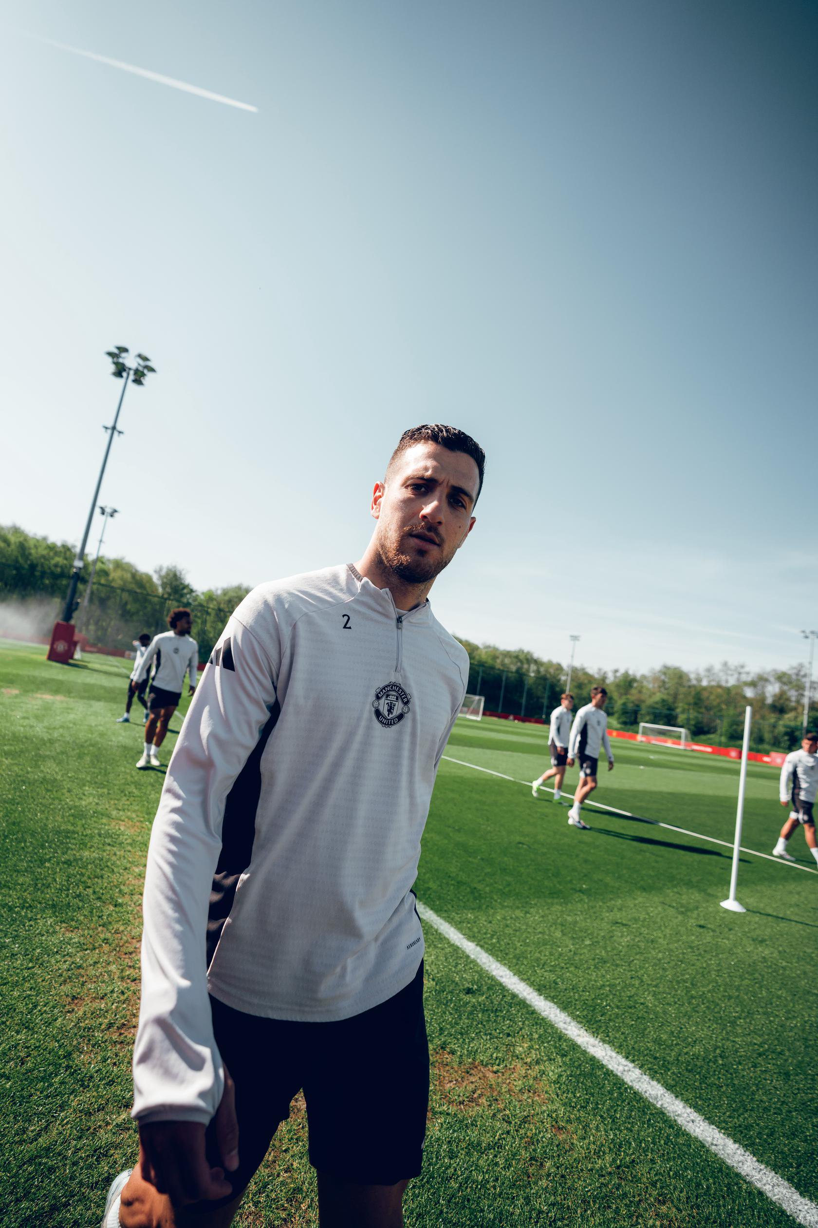 Image: Diogo Dalot warming up at Carrington