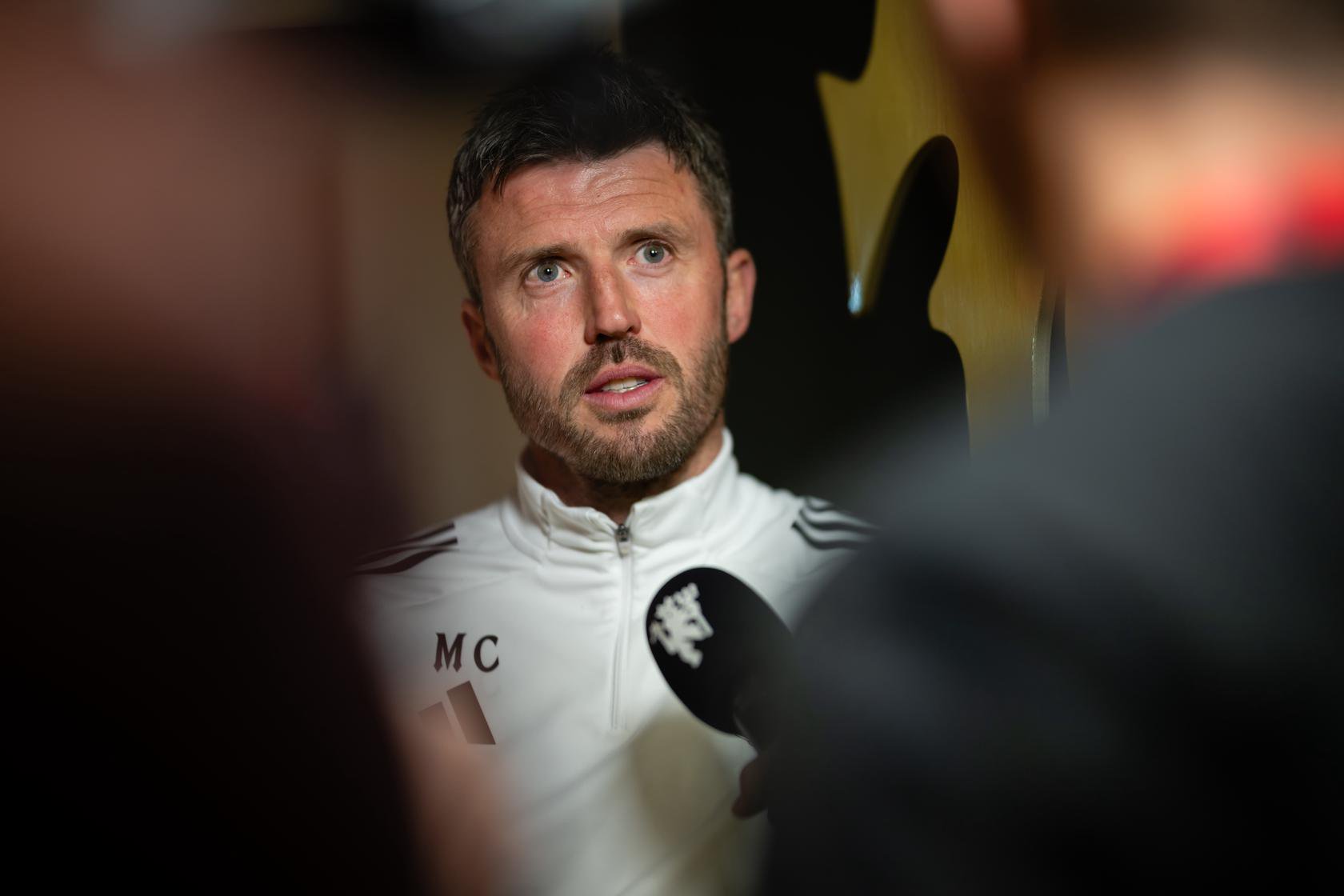 Michael Carrick speaking to Mark Sullivan before Liverpool game