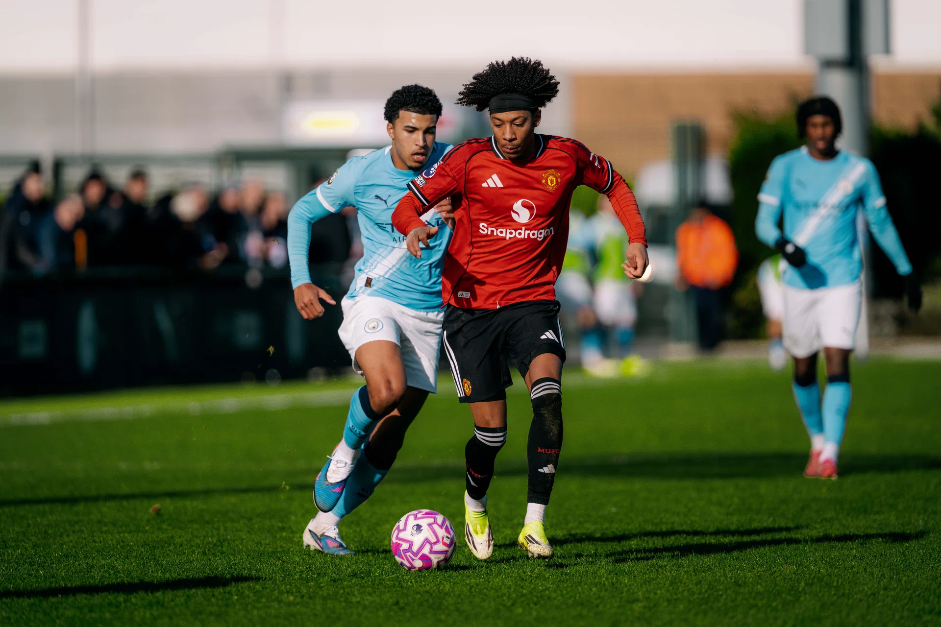 Action from United U18s win at Man City