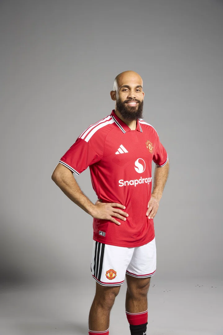 Bryan Mbeumo smiling in the new shirt