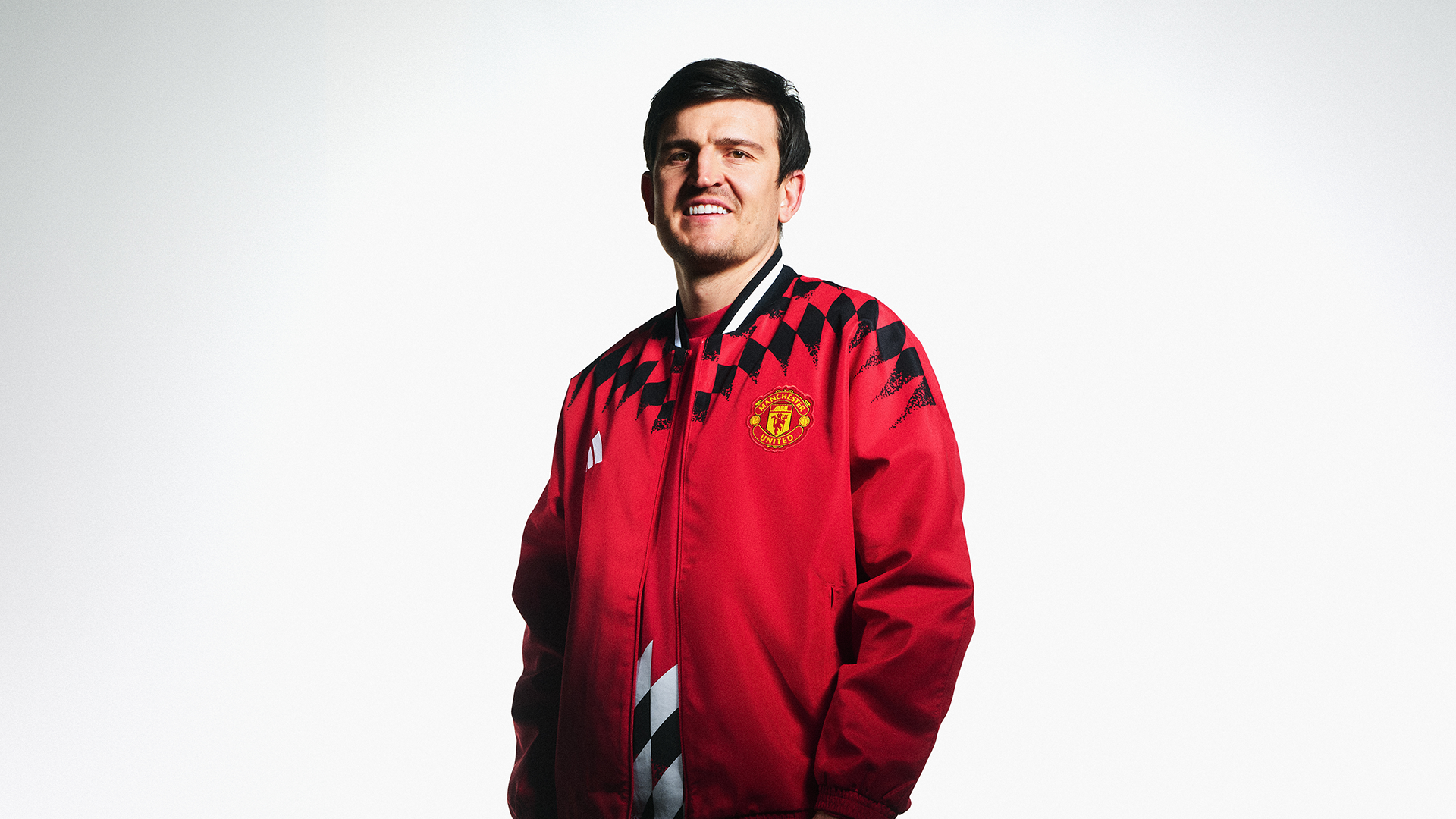 Harry Maguire in red track top