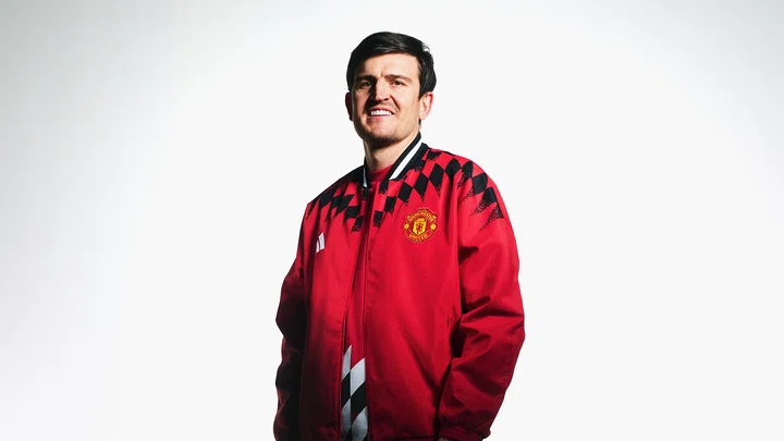 Harry Maguire in red track top