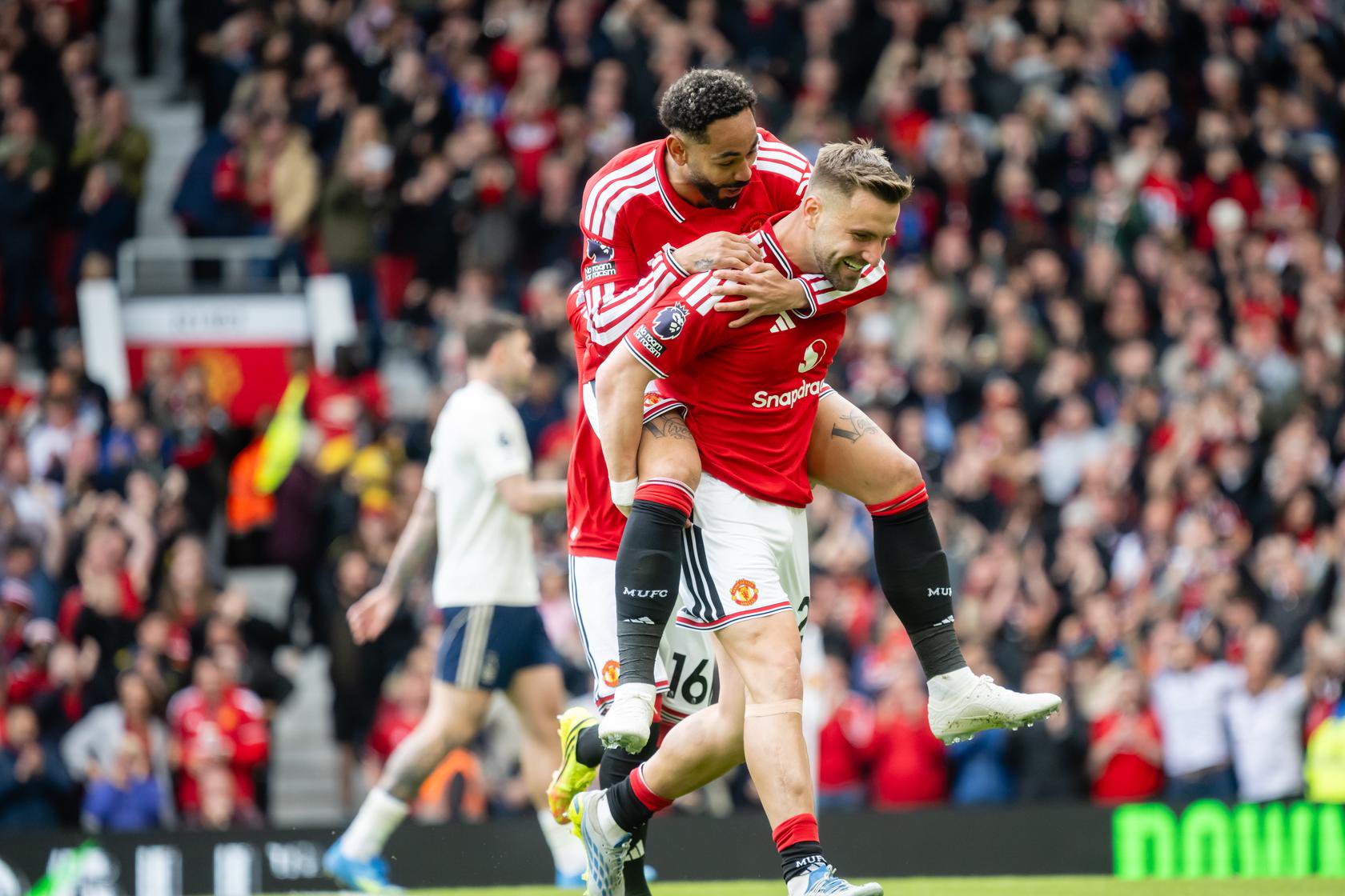 Matheus Cunha and Luke Shaw celebrate against Nottingham Forest