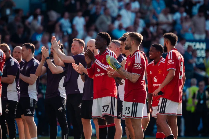 Man Utd players celebrate after the final whistle at Brighton