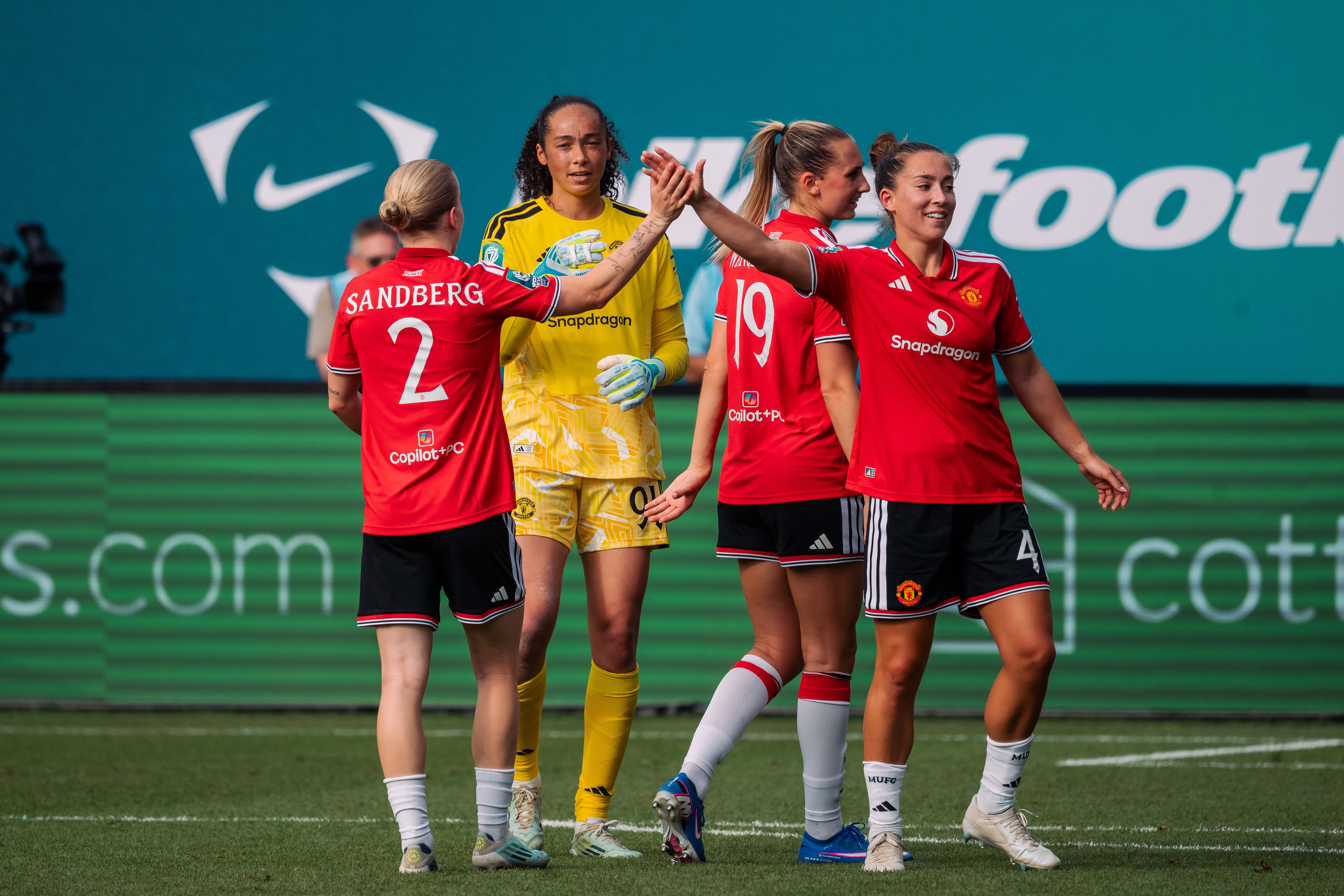 Maya Le Tissier high fives Anna Sandberg at World Sevens
