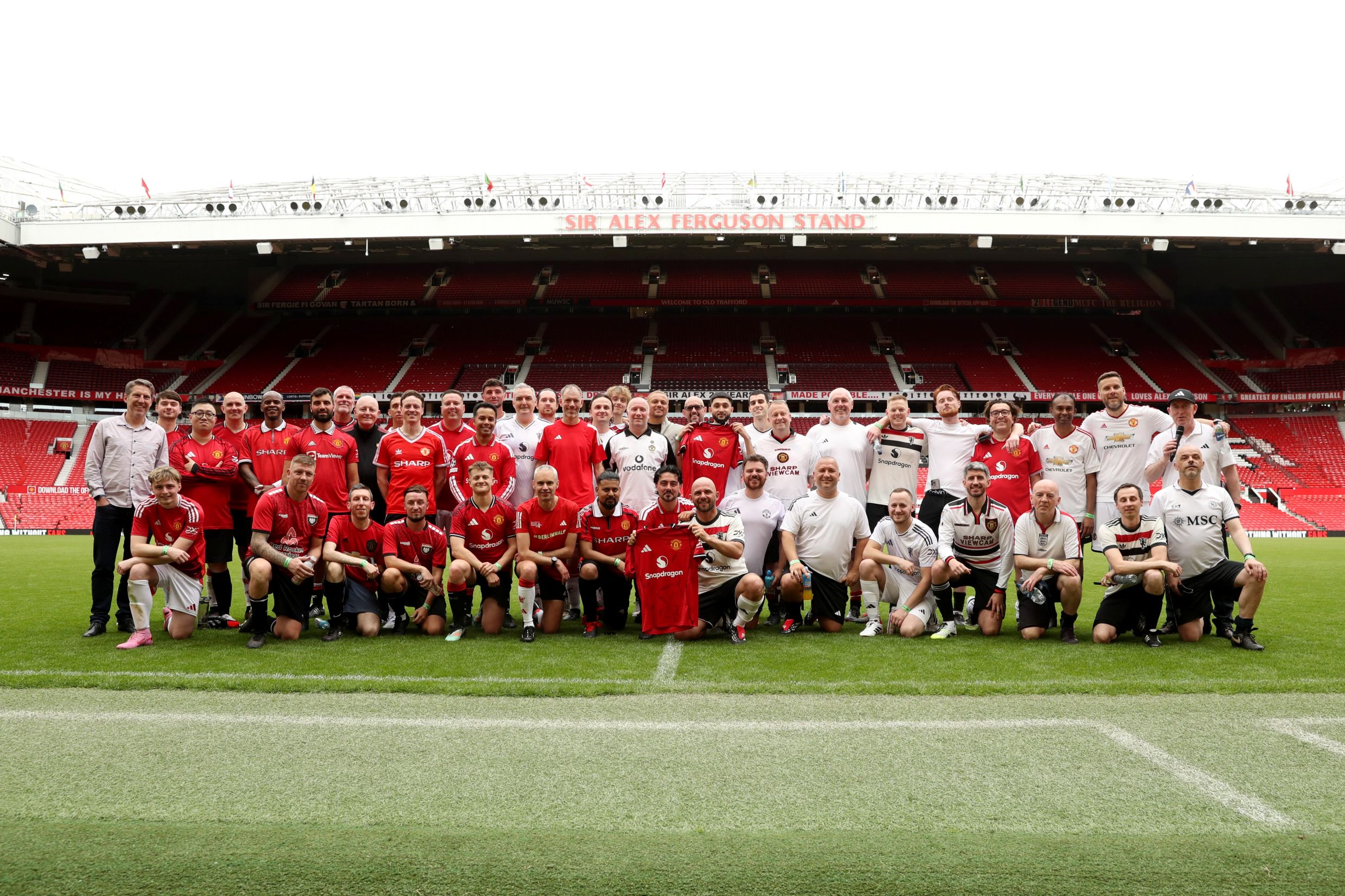 Old Trafford fan pitch day group photo