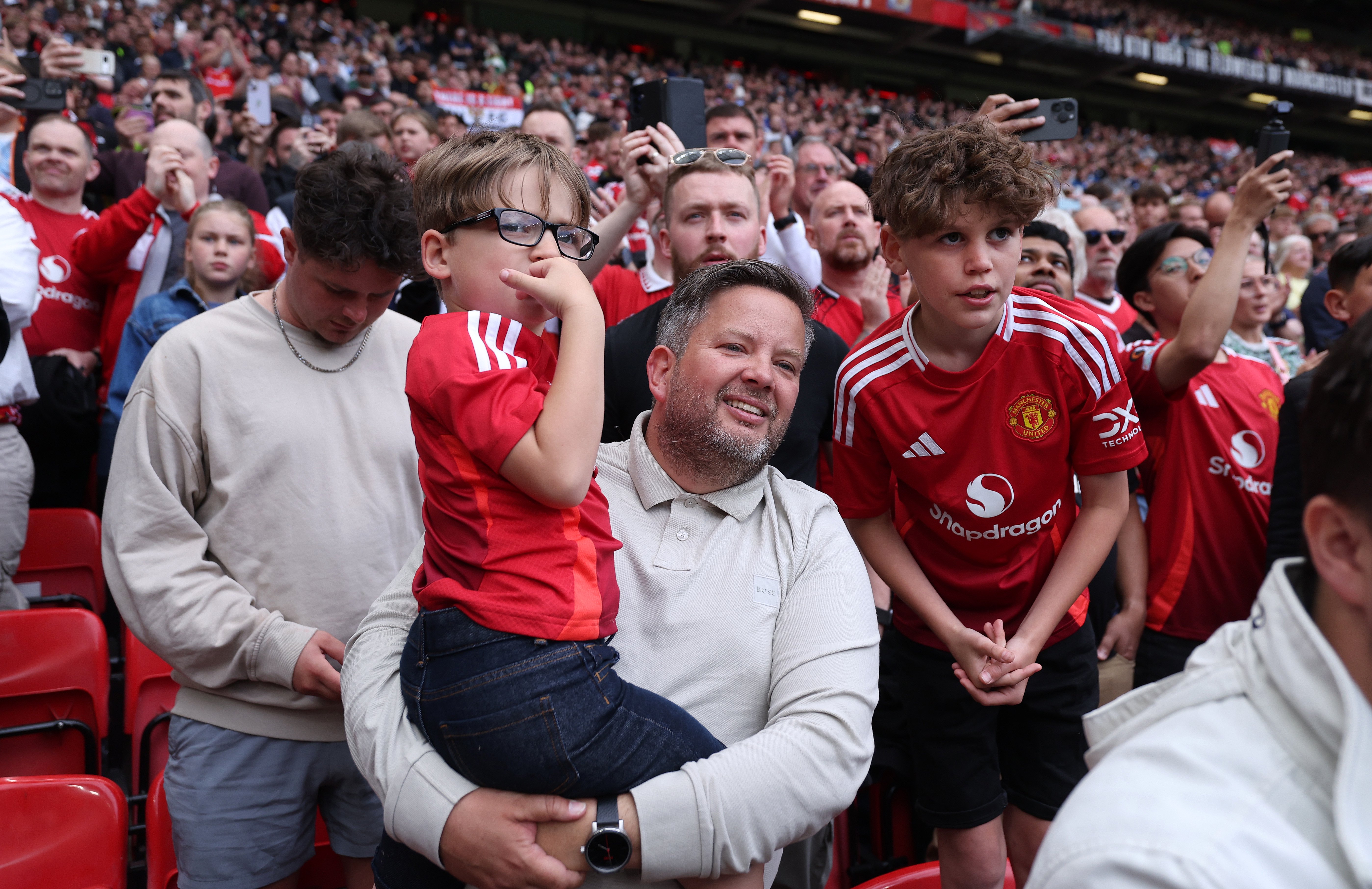 Image: Father with two sons at Aston Villa game 2025
