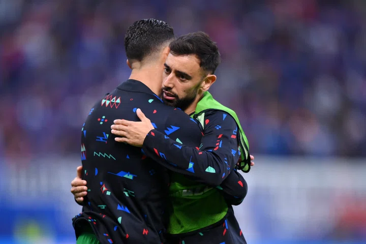 Bruno Fernandes hugs Portugal teammate Cristiano Ronaldo