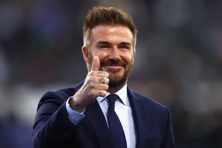 David Beckham smiling and giving thumbs up to the camera