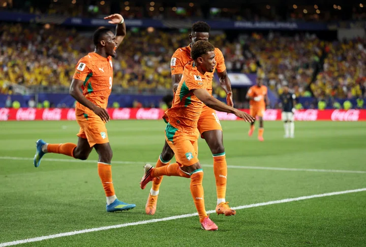 Amad celebrates late Ivory Coast winner with team-mates v Ecuador