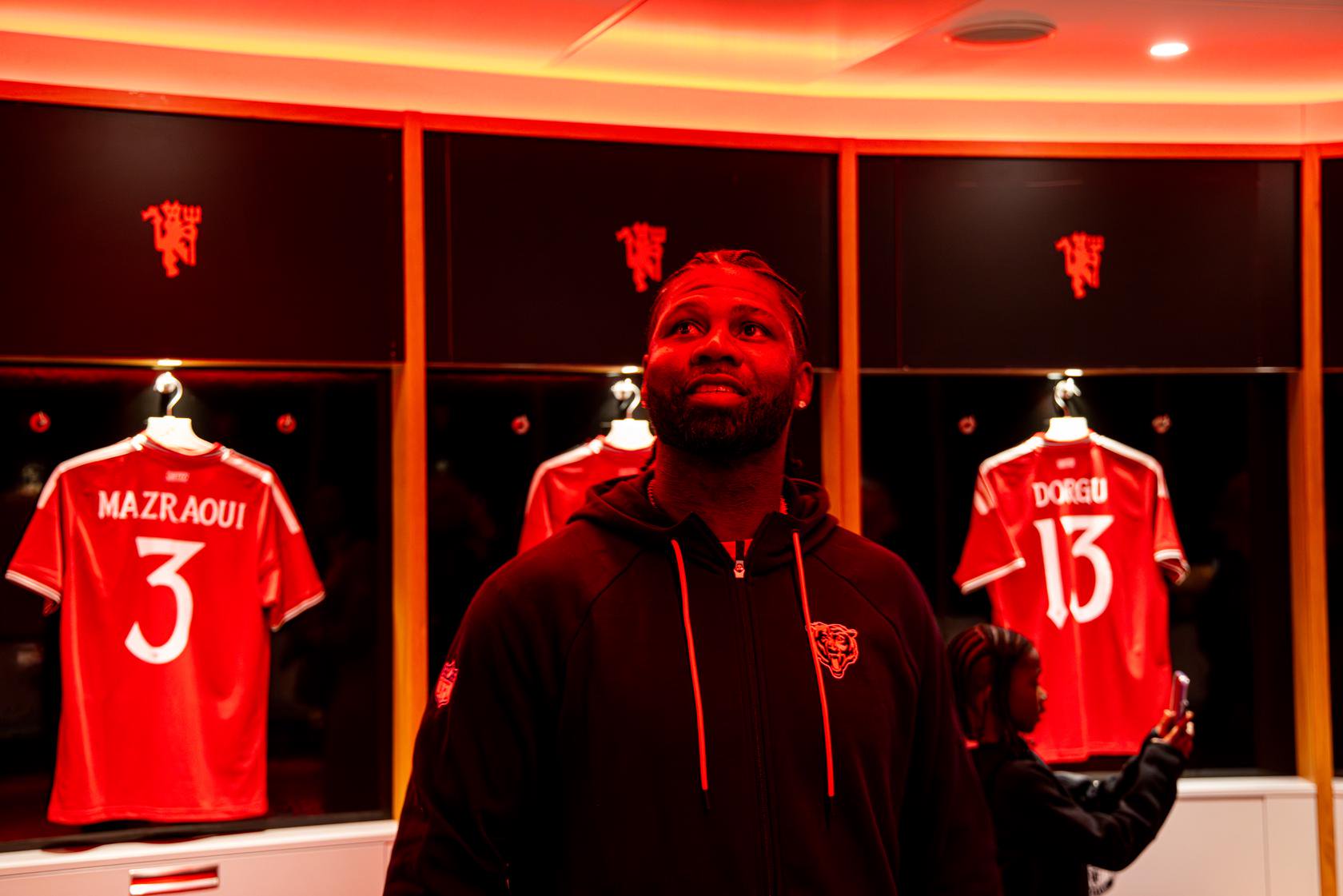 Devin Hester looking round Old Trafford dressing room