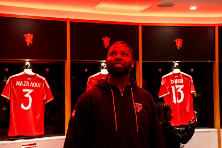 Devin Hester looking round Old Trafford dressing room