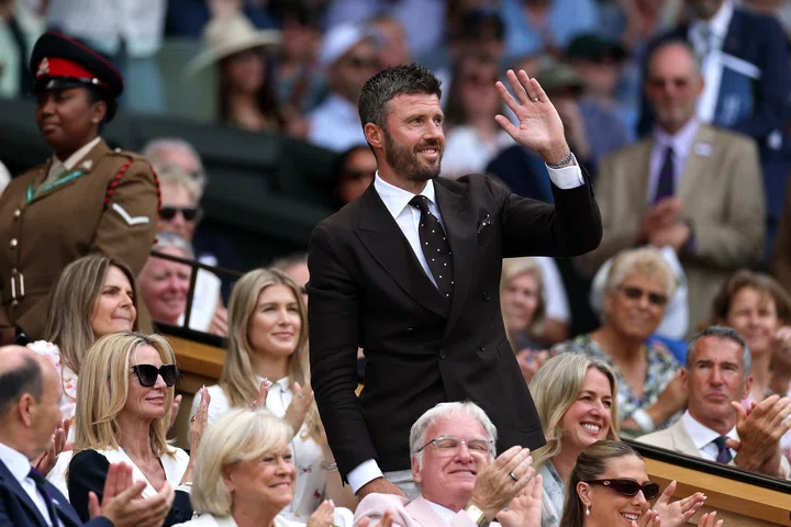 Michael Carrick waving to the crowd from Centre Court's Royal Box.