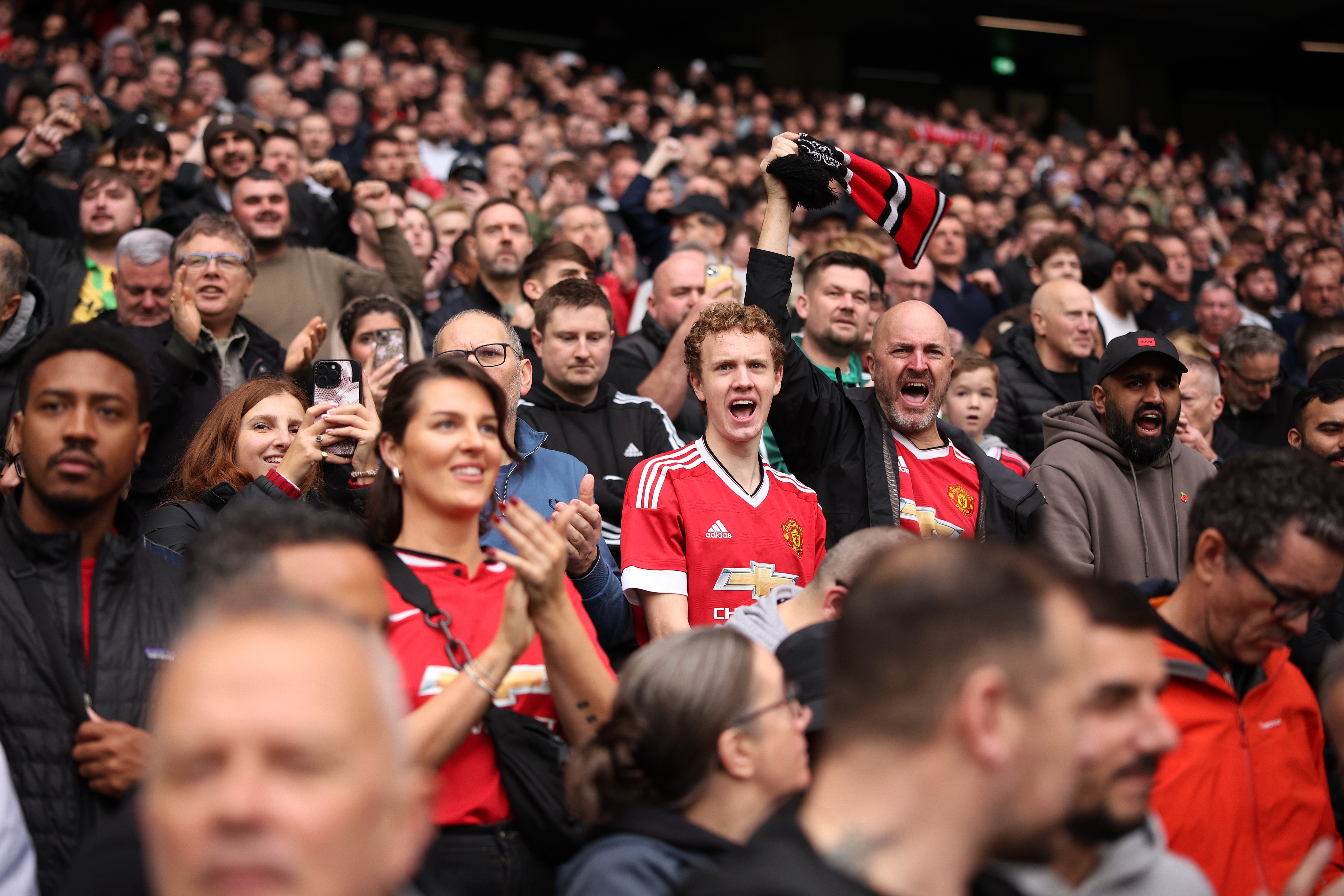 Image: United fans at Old Trafford for Supporters Club ad card