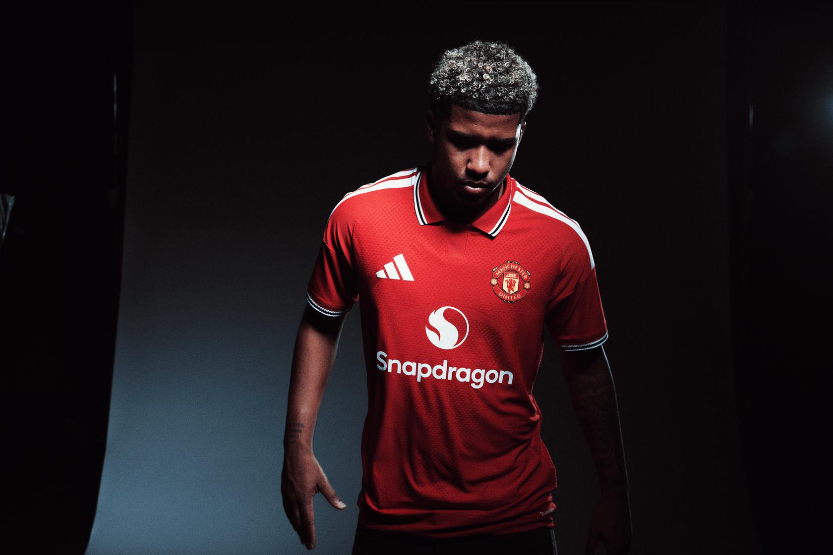 Andrey Santos looks down in Man Utd home shirt