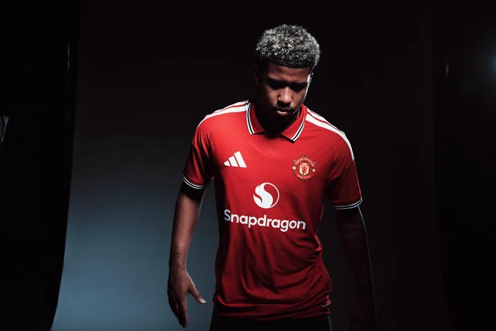 Andrey Santos looks down in Man Utd home shirt