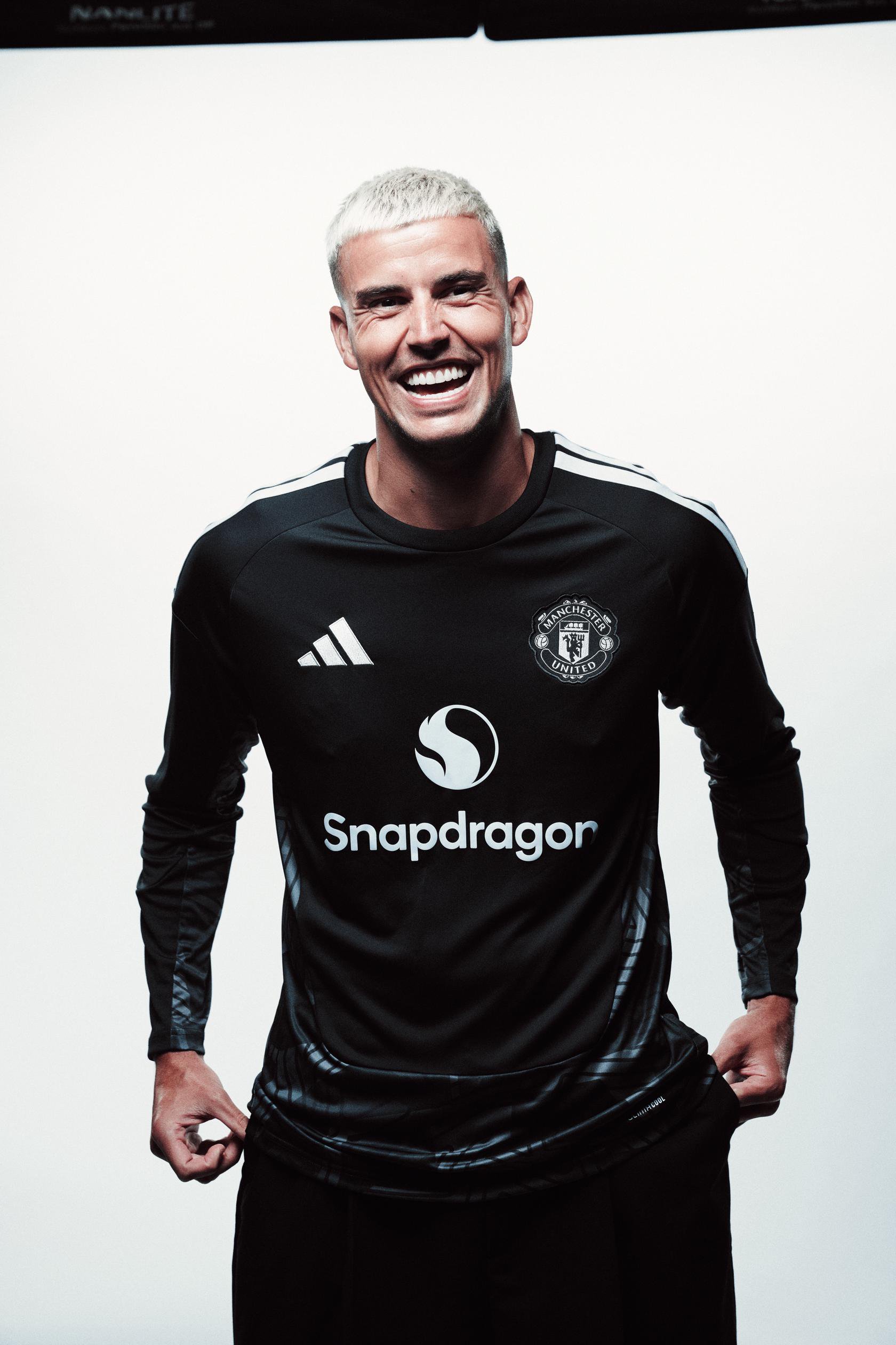 Karl Darlow laughing in black keeper shirt