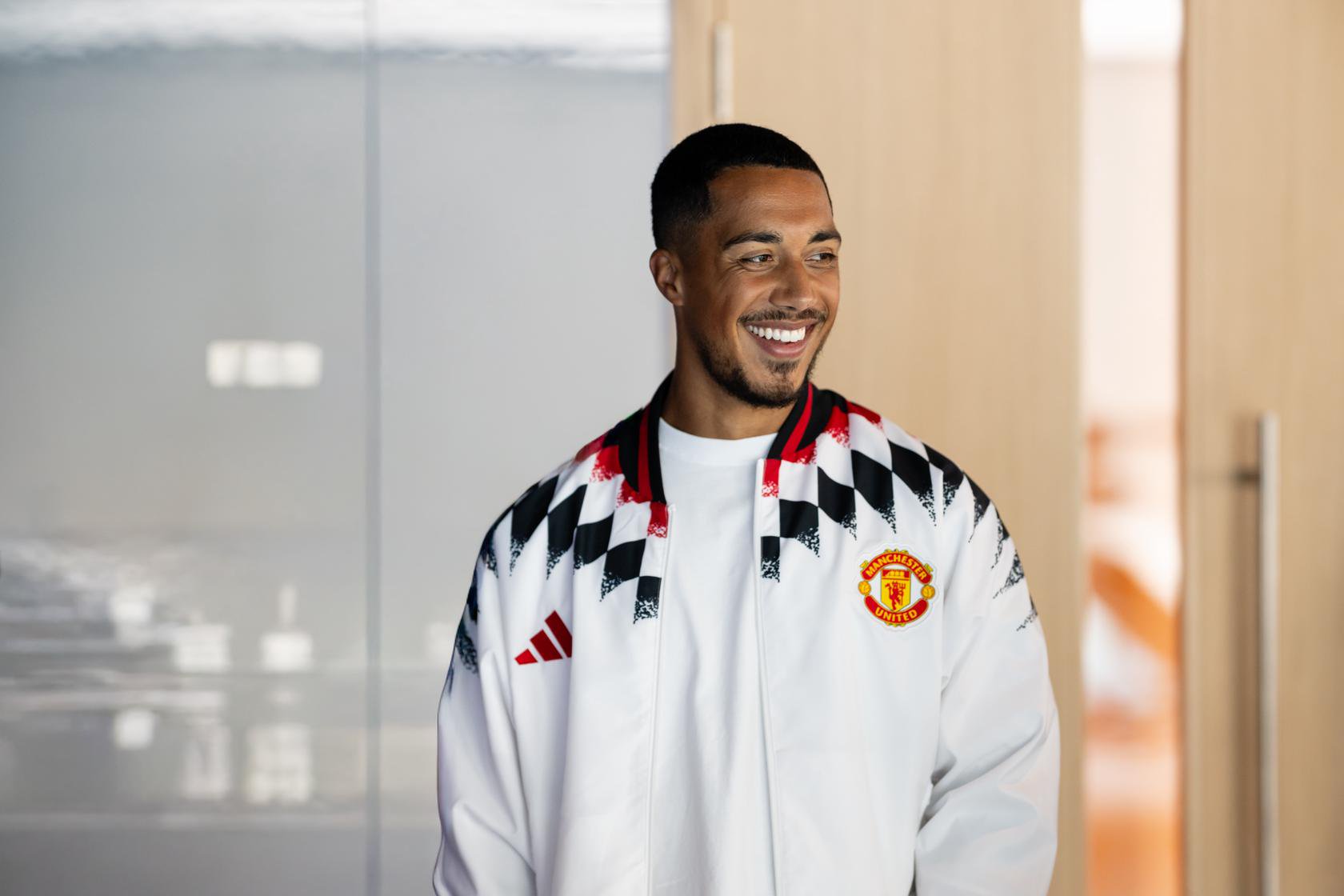 Youri Tielemans smiles at Carrington on Manchester United signing day