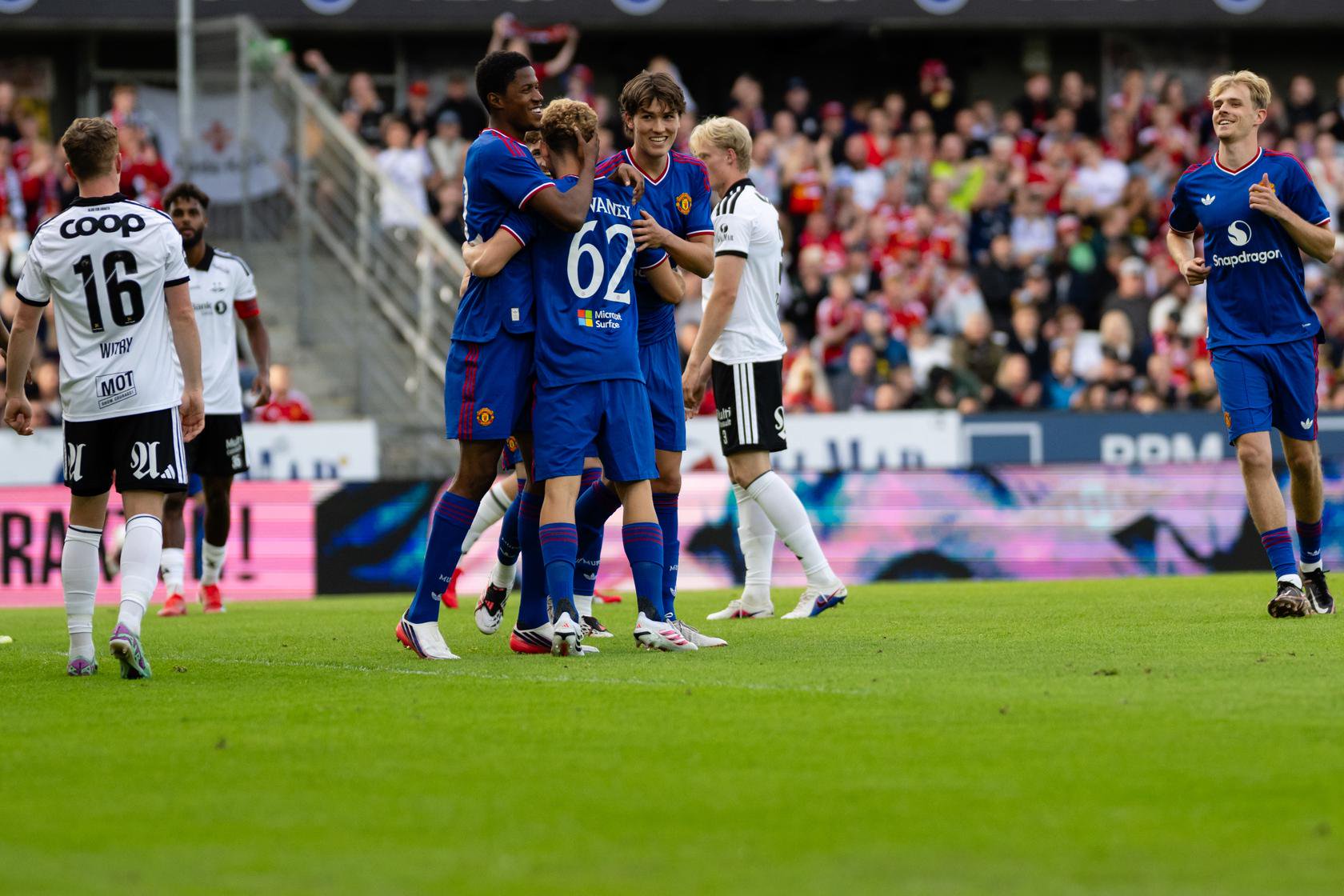 Jacob Devaney celebrates his goal against Rosenborg with his team-mates