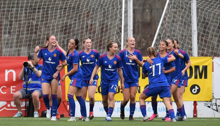 United Women U16s celebrate a goal v Liverpool