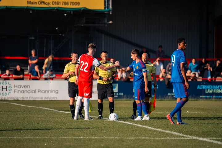 Dan Gore shakes hands with Altrincham's Tom Crawford before U21s friendly 31 July 2026