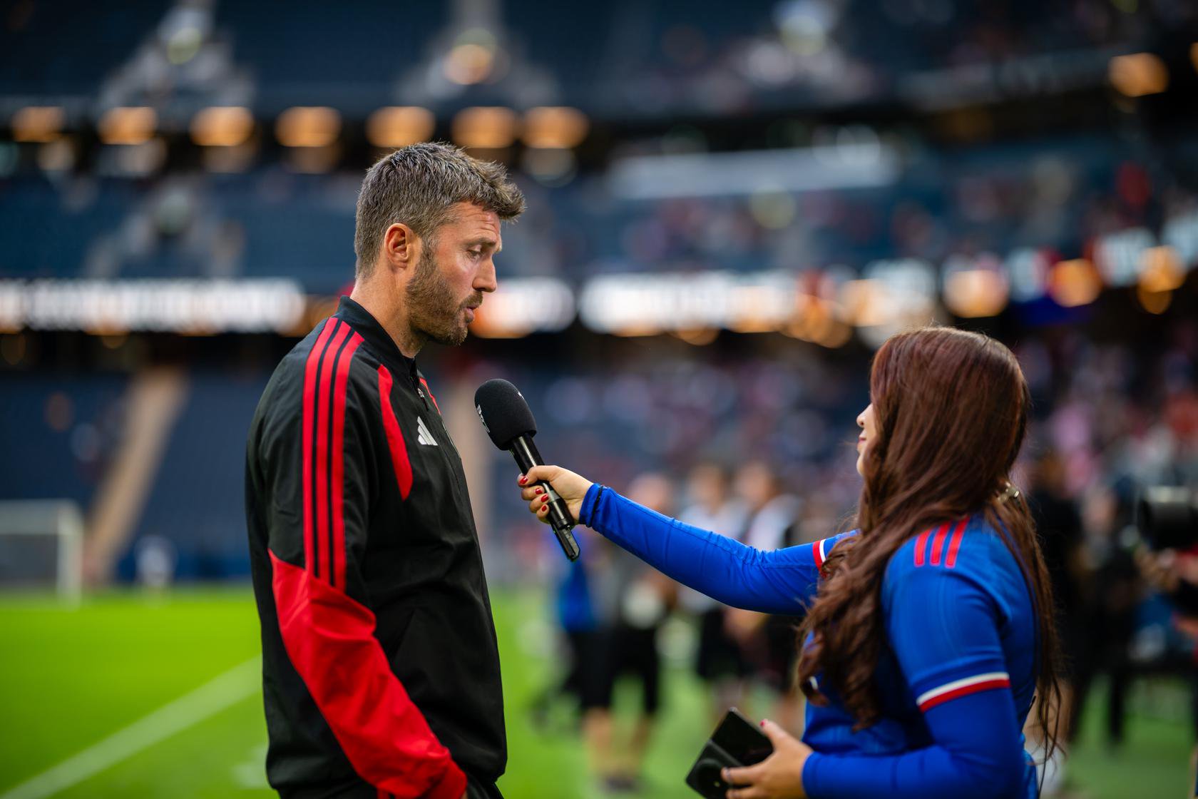 Michael Carrick speaks to MUTV on the pitch at the Strawberry Arena