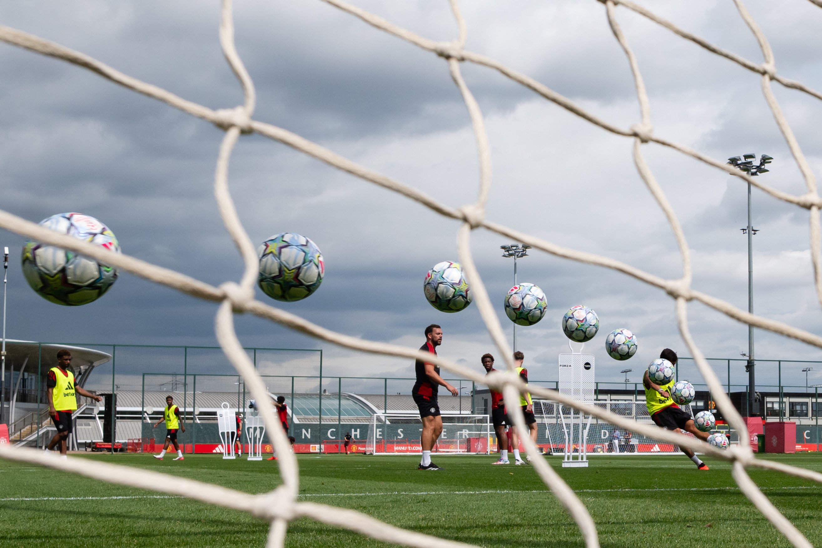 Arty shot of Shea Lacey shooting with balls