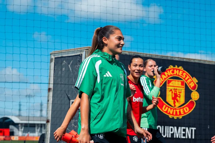 Safia Middleton-Patel smiling while walking out to training