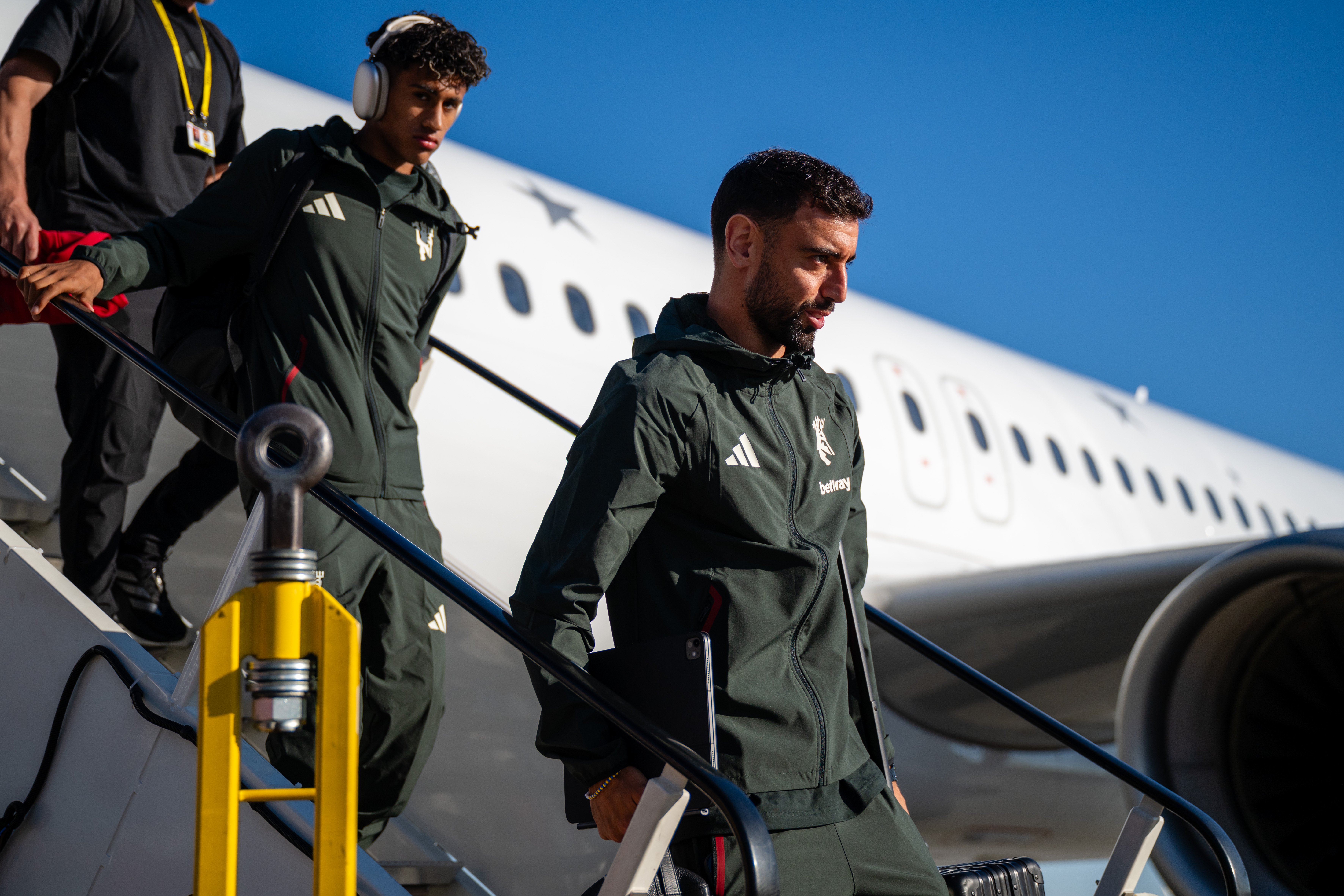 Bruno Fernandes walks off plane in Wroclaw, Poland