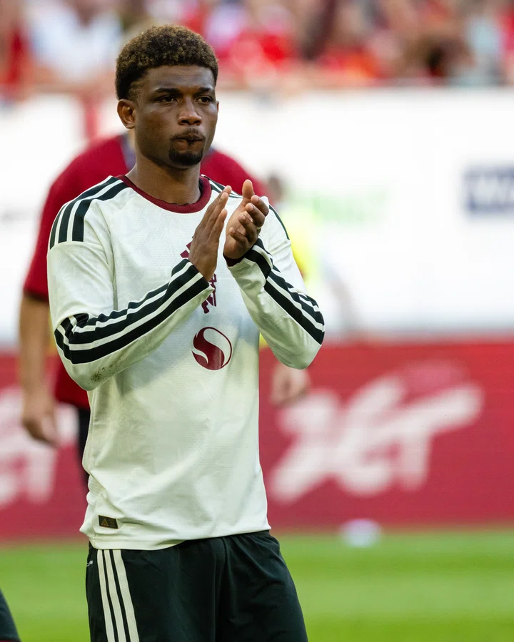 Amad claps in white shirt in Poland