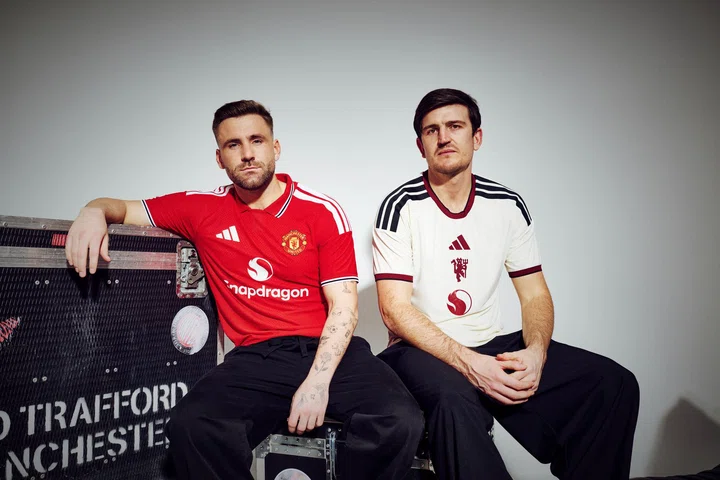 Luke Shaw in home kit and Harry Maguire in third kit