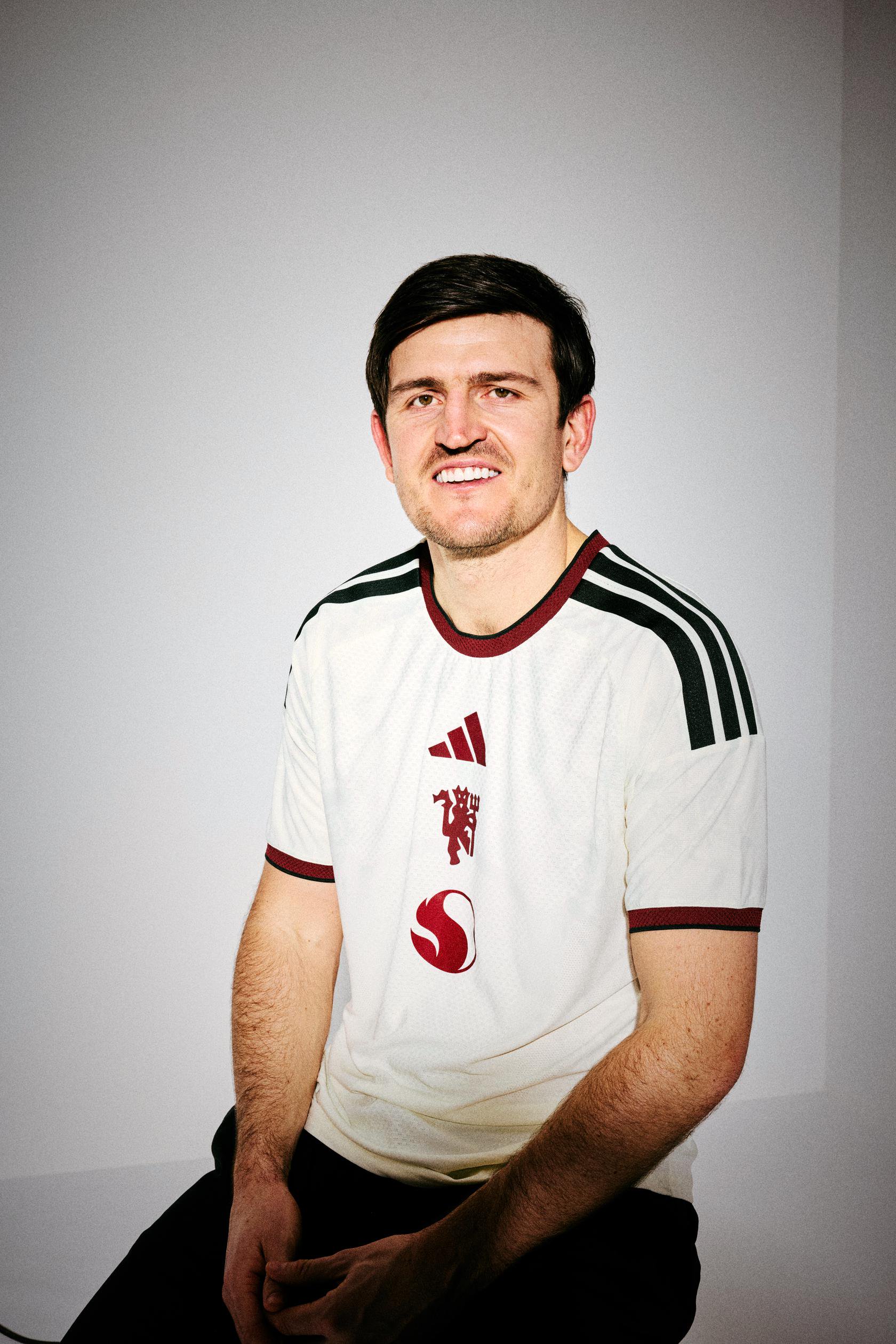 Harry Maguire in the white shirt posing