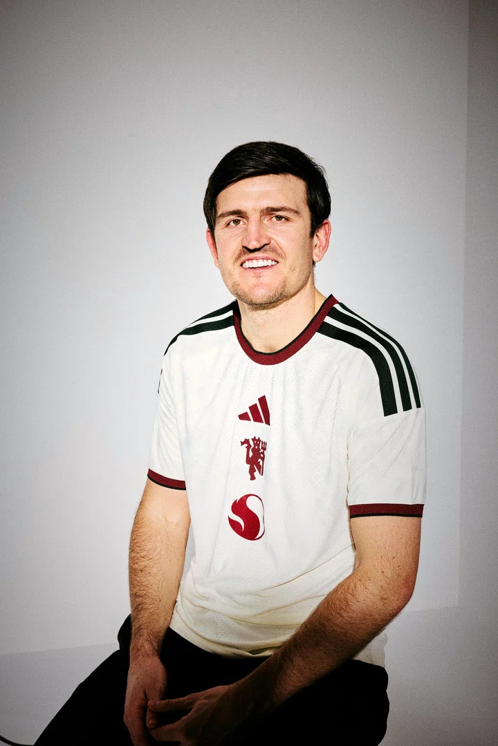 Harry Maguire in the white shirt posing