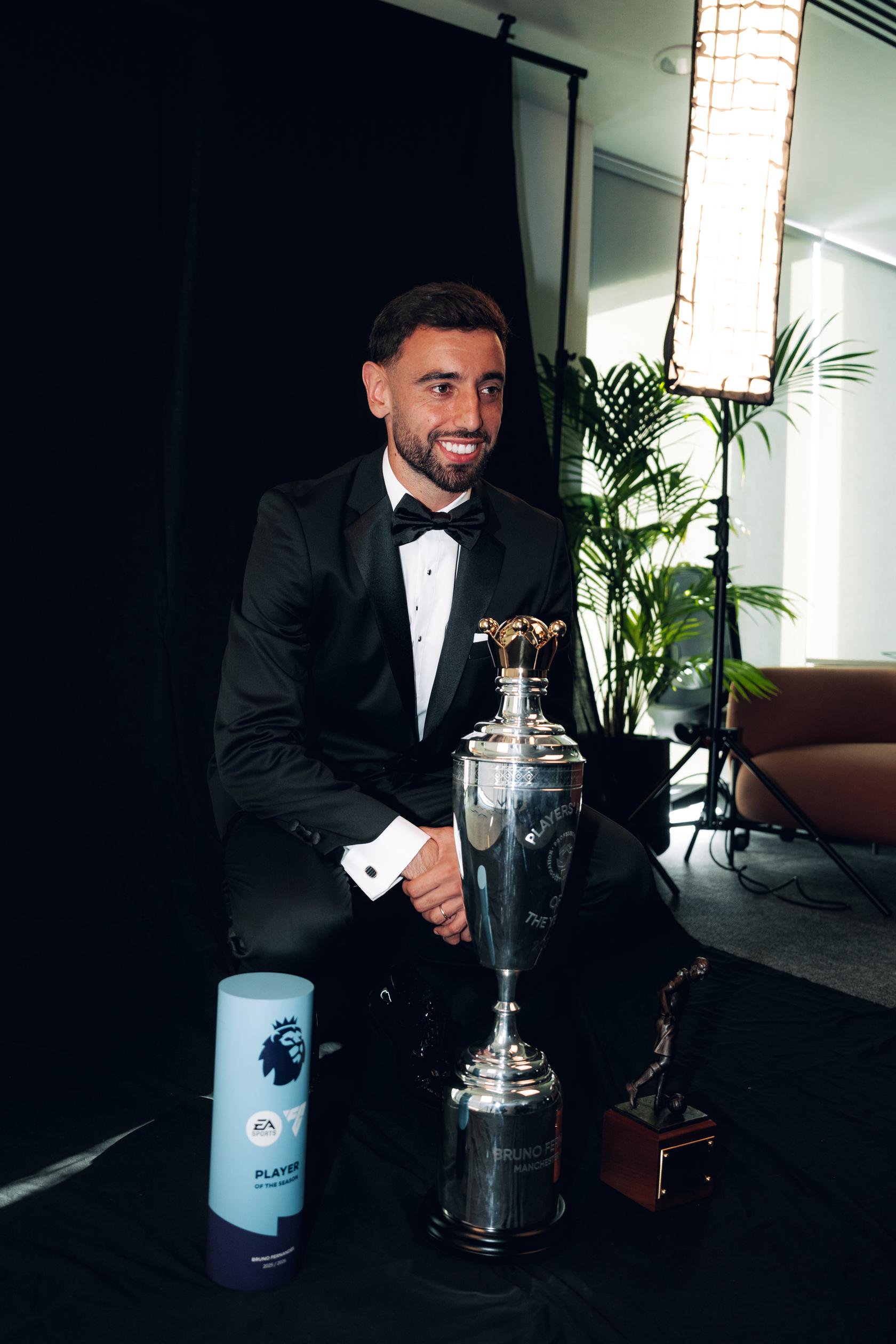 Bruno Fernandes with PL Player of the Season and PFA Player of the Year trophies