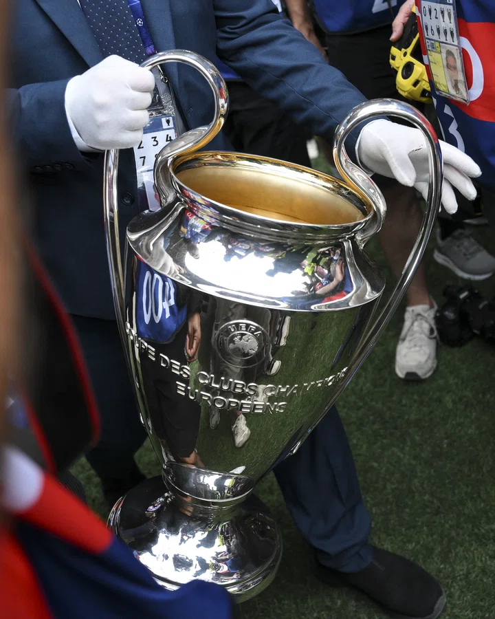 Champions League trophy handled with gloves