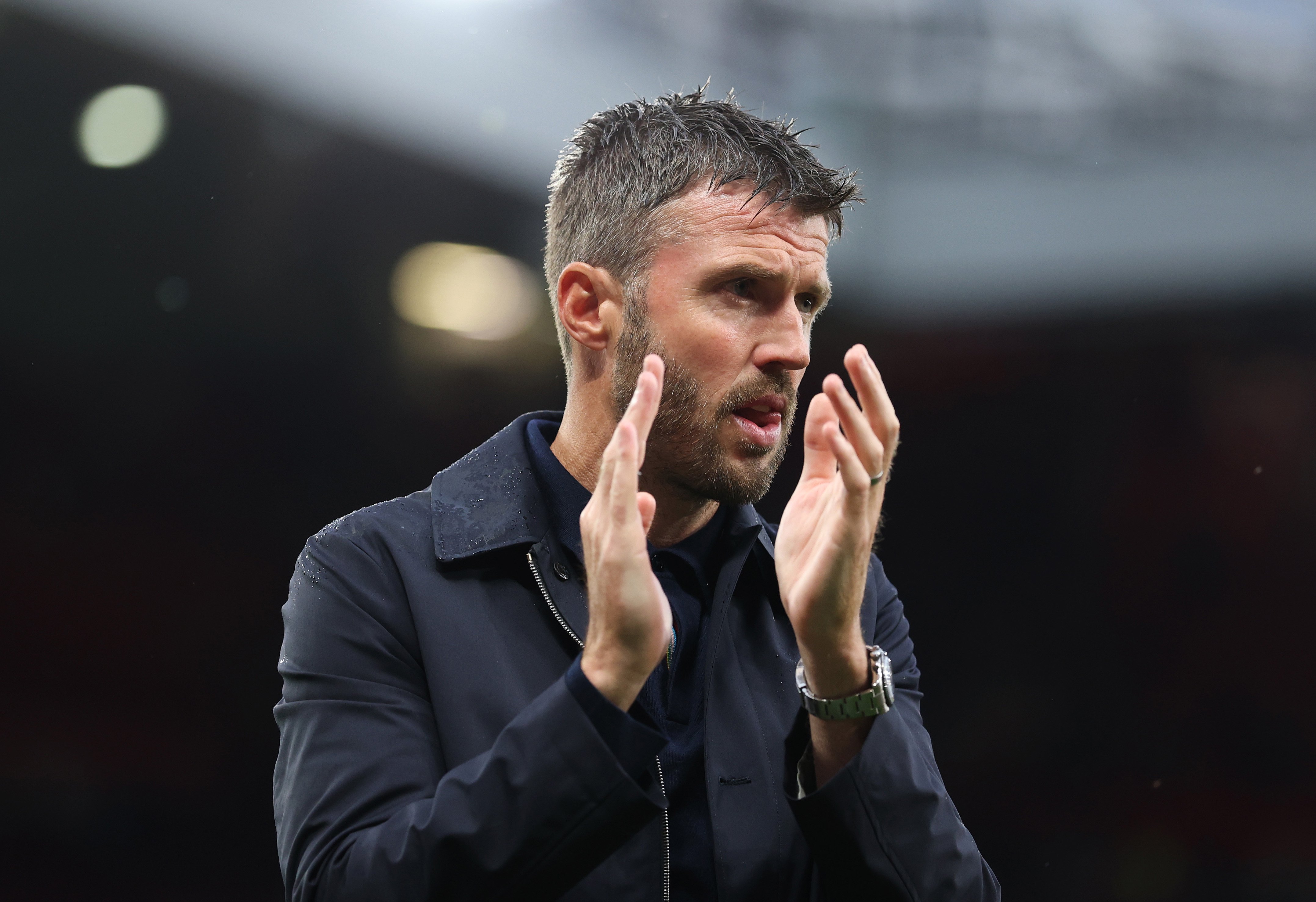 Michael Carrick wet hair applauds fans after Ipswich win