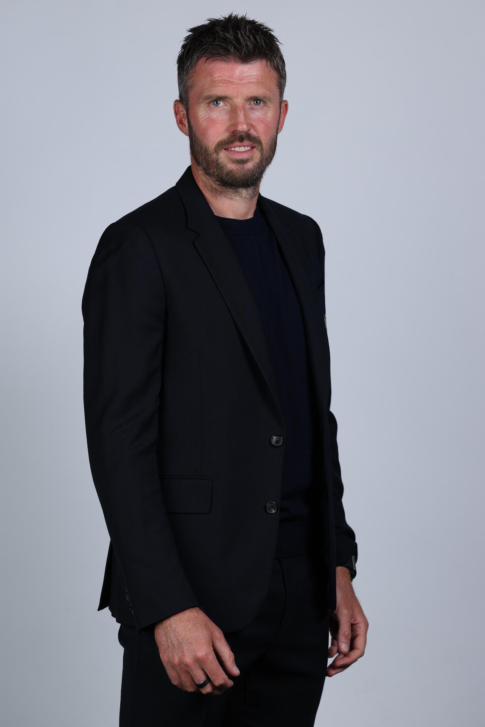 Michael Carrick in suit smiling