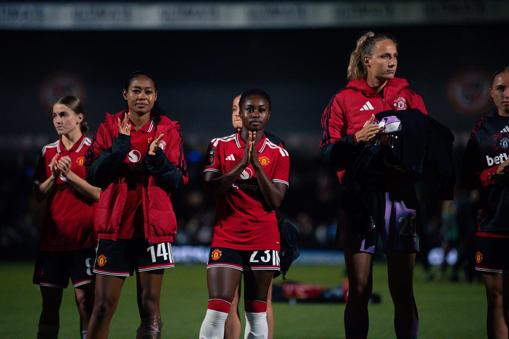 Monica Jusu Bah clapping fans after debut v London City
