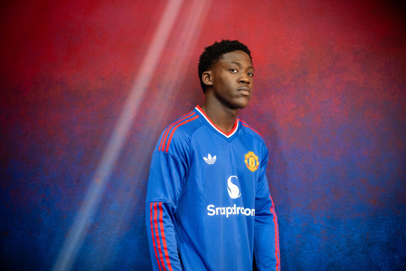 Kobbie Mainoo in blue shirt