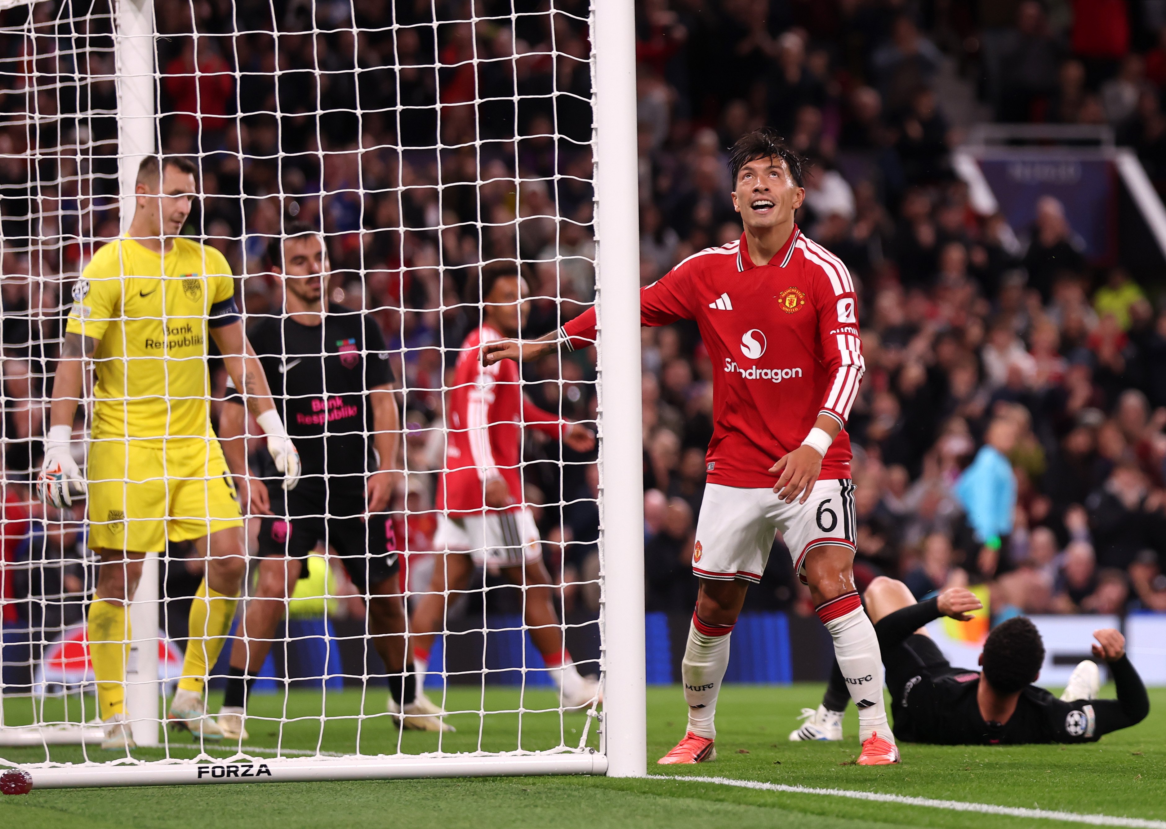 Lisandro Martinez scores at the Stretford End