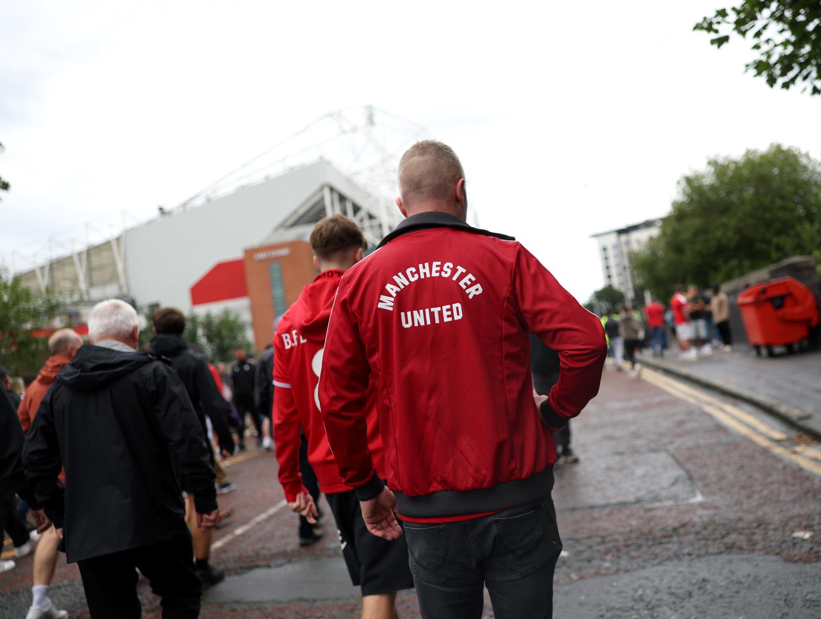 A United fan walking to Old Trafford
