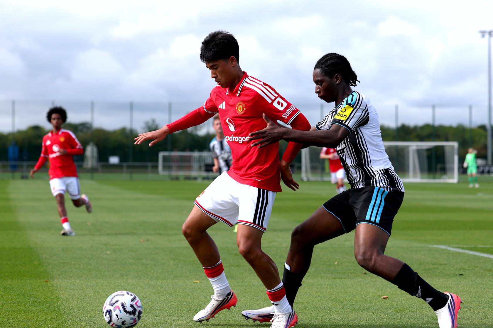 Jariyah Shah battles for the ball with Newcastle's Jayden Koussou