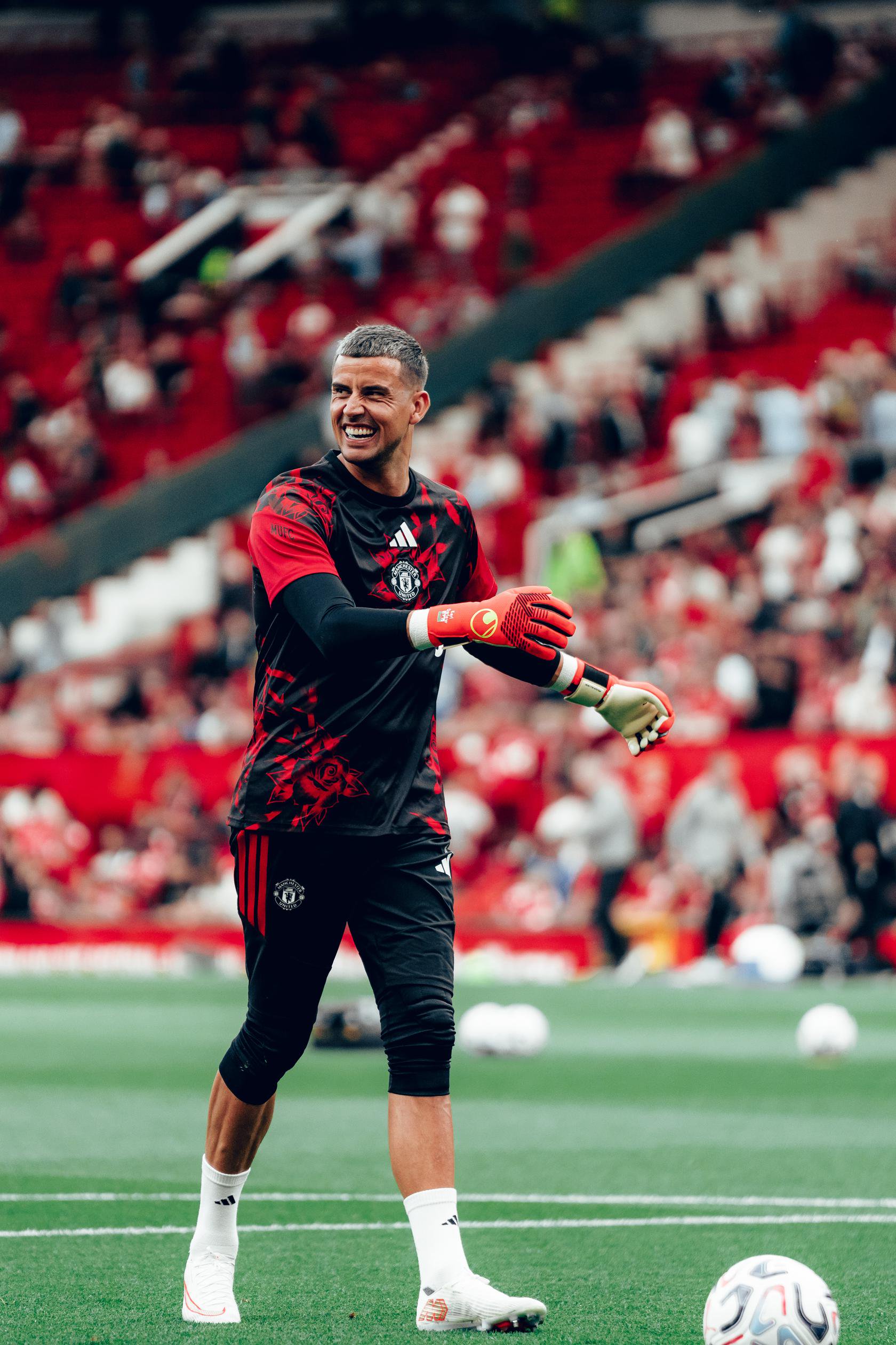Karl Darlow smiling while warming up for United v Man City | 13 Sep 2026