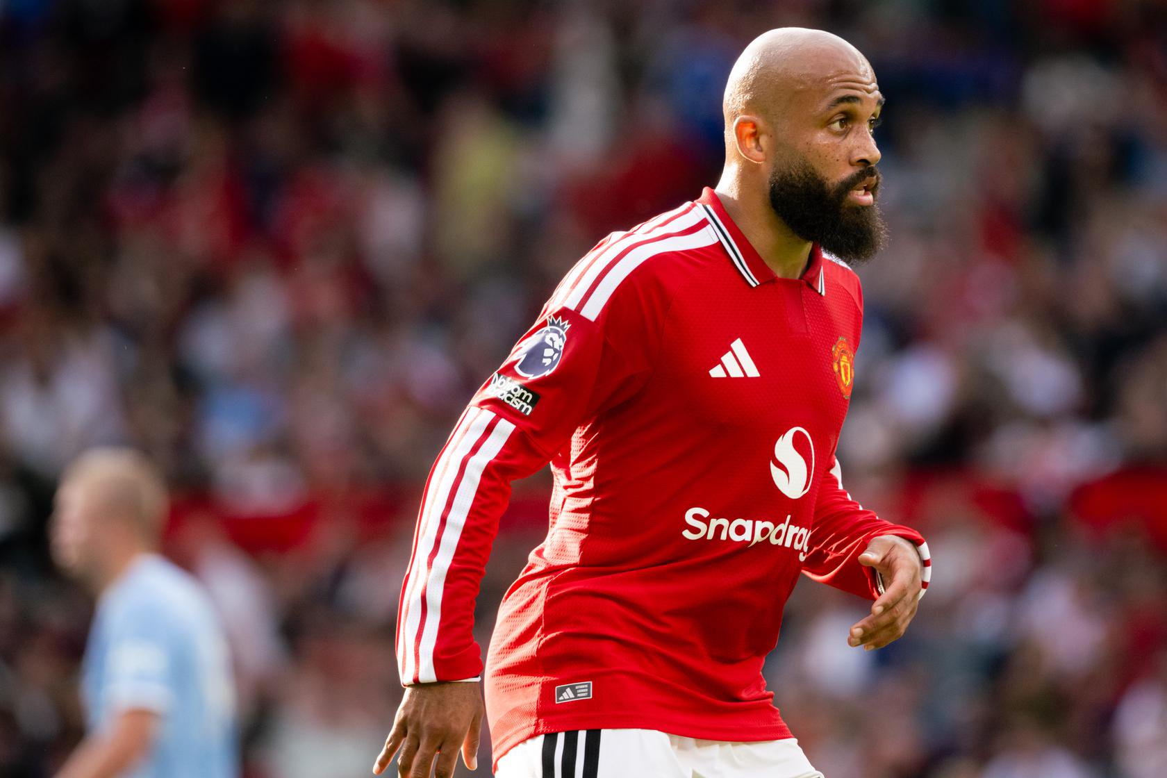 Bryan Mbeumo looks on in Manchester derby