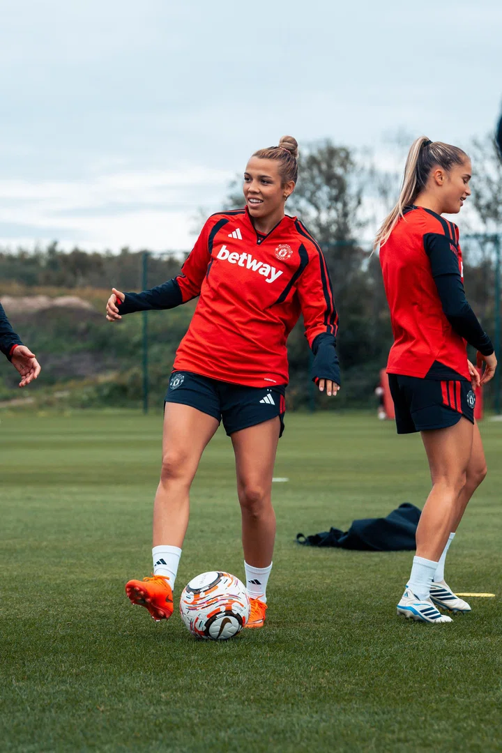 Celin Bizet Donnum smiling while kicking ball in training