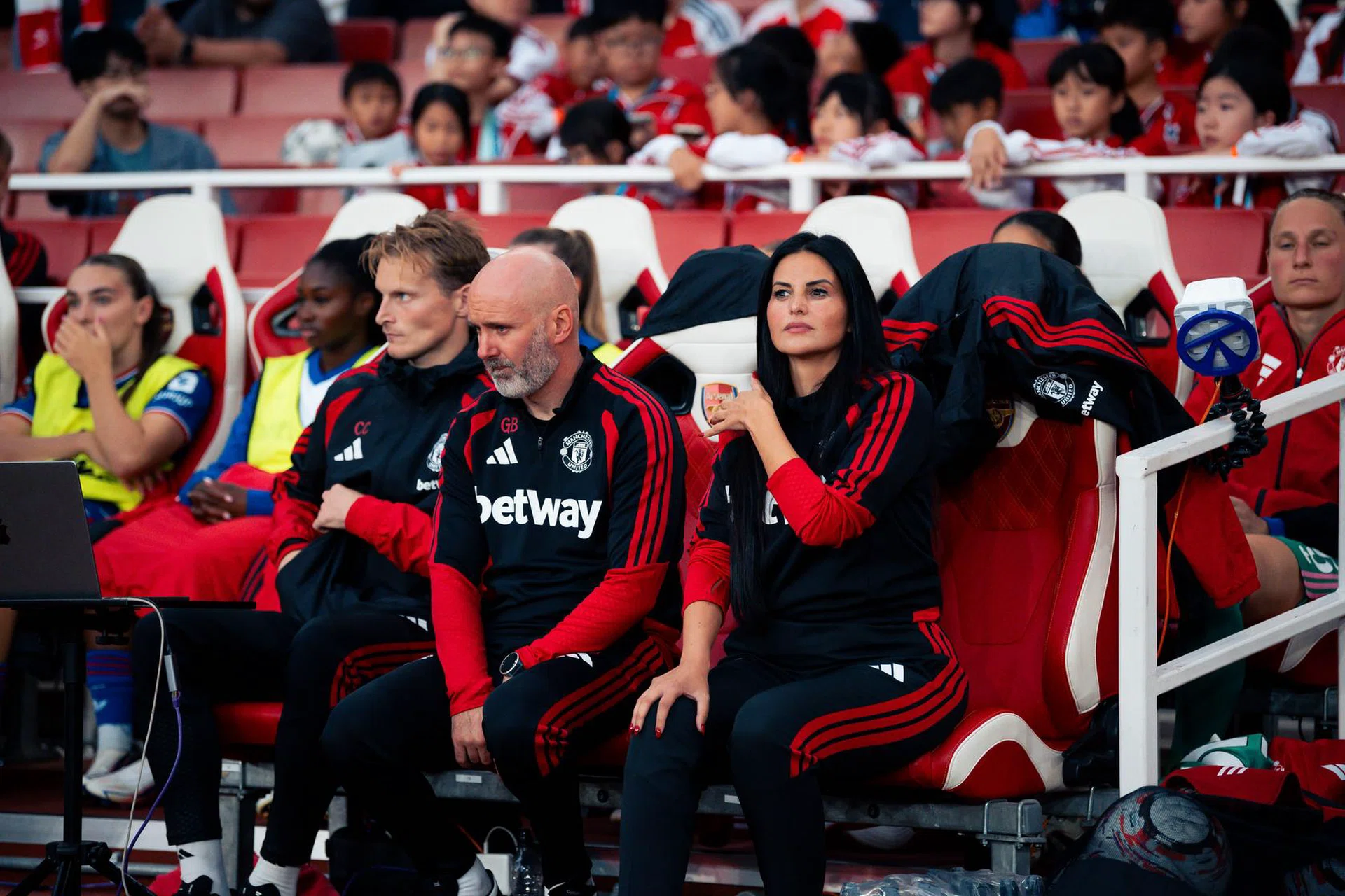 Eva Olid looks on from her seat against Arsenal