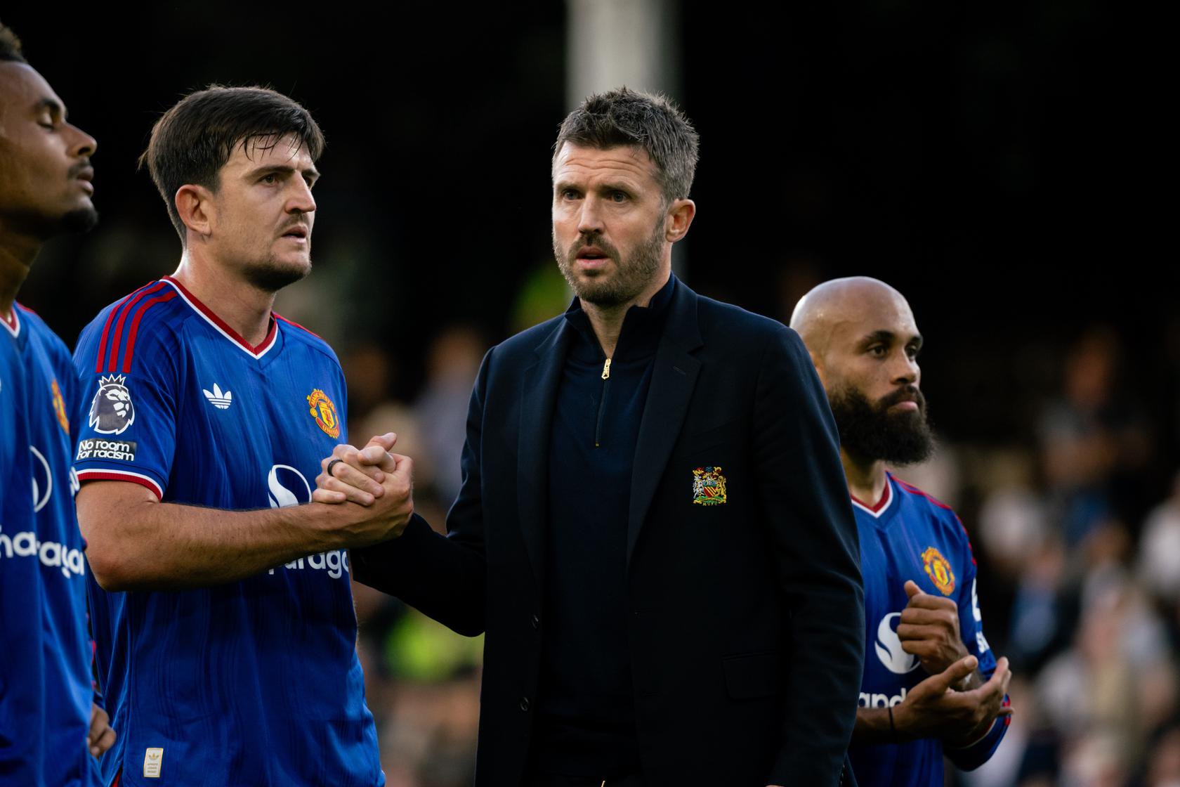 Michael Carrick with Harry Maguire