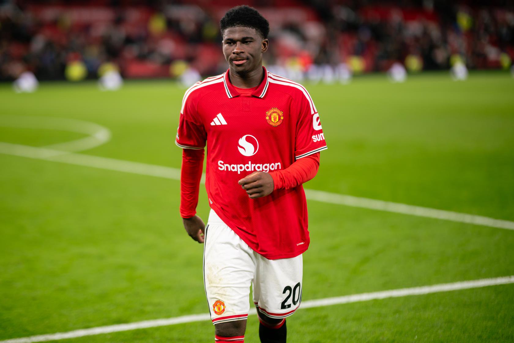 Carlos Baleba wearing Manchester United's red kit in 2026